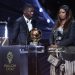 Paris Saint-Germain's French forward Ousmane Dembele stands on stage next to his mother after receiving the Ballon d'Or award during the 2025 Ballon d'Or France Football award ceremony (Photo by FRANCK FIFE/AFP via Getty Images)