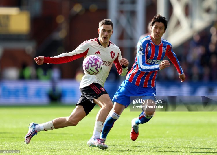 Florian Wirtz of Liverpool controls the ball whilst under pressure from Daichi Kamada of Crystal Palace during the Premier League match between Crystal Palace (Photo by Tom Dulat/Getty Images)