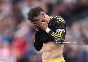 Bruno Fernandes of Manchester United  reacts after seeing his penalty shot saved during the Premier League match between Brentford and Manchester United (Photo by Catherine Ivill - AMA/Getty Images)