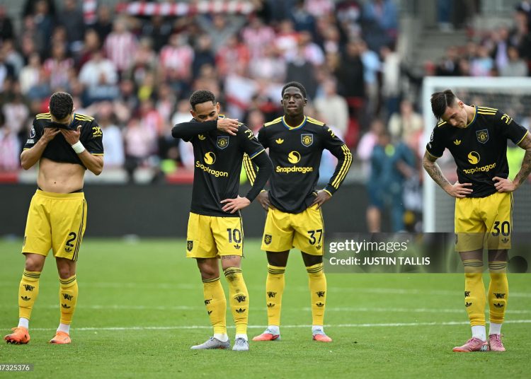(L-R) Manchester United's Portuguese defender #02 Diogo Dalot, Manchester United's Brazilian striker #10 Matheus Cunha, Manchester United's English midfielder #37 Kobbie Mainoo and Manchester United's Slovenian striker #30 Benjamin Sesko react on the pitch after the English Premier League football match between Brentford and Manchester United at the Gtech Community Stadium in London on September 27, 2025. Brentford won the game 3-1 (Photo by JUSTIN TALLIS/AFP via Getty Images)