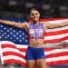 Gold medalist Sydney McLaughlin-Levrone of Team United States poses for a photo with the national flag of United States after winning the Women's 400 Metres Final (Photo by Hannah Peters/Getty Images)