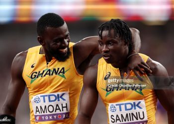 TOKYO, JAPAN - SEPTEMBER 20: Joseph Paul Amoah embraces teammate Abdul-Rasheed Saminu following the Men's 4x100m Relay Heats on day eight of the World Athletics Championships Tokyo 2025 at National Stadium on September 20, 2025 in Tokyo, Japan.  (Photo by Christian Petersen/Getty Images)