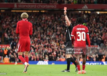 Hugo Ekitike of Liverpool celebrates scoring his team's second goal by removing his match shirt and subsequently receives a second yellow card from Referee Thomas Bramall to be sent off during the Carabao Cup Third Round match between Liverpool and Southampton at Anfield on September 23, 2025 in Liverpool, England. (Photo by Jan Kruger/Getty Images)