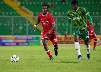 Peter Amidu (red) in action for Kotoko against Gold Stars Photo Courtesy: AKSC