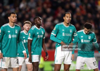 Virgil van Dijk of Liverpool looks on alongside teammates during the Premier League match between Brentford and Liverpool (Photo by Alex Pantling/Getty Images)