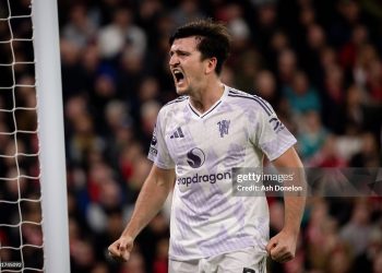 Harry Maguire of Manchester United celebrates scoring a goal to make the score 1-2  during the Premier League match between Liverpool and Manchester United at Anfield  (Photo by Ash Donelon/Manchester United via Getty Images)