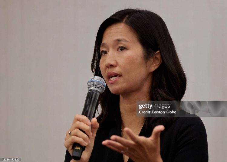Mayor Michelle Wu answers a question from the chamber's president and CEO Jim Rooney (not shown) (Photo by Pat Greenhouse/The Boston Globe via Getty Images)