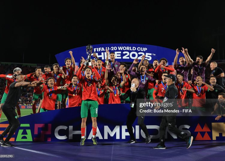 Houssam Essadak of Morocco lifts the FIFA U-20 World Cup trophy following his side's victory in the FIFA U-20 World Cup Chile 2025 final match between Argentina and Morocco (Photo by Buda Mendes - FIFA/FIFA via Getty Images)
