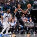 Victor Wembanyama #1 of the San Antonio Spurs handles the ball as Naji Marshall #13 of the Dallas Mavericks plays defense during the game (Photo by Glenn James/NBAE via Getty Images)