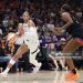 A'ja Wilson #22 of the Las Vegas Aces drives to the basket against Kalani Brown #21 of the Phoenix Mercury in the third quarter during Game Four of the 2025 WNBA Playoffs  (Photo by Christian Petersen/Getty Images)