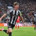Anthony Gordon of Newcastle United celebrates after scoring a goal to make it 1-0 during the UEFA Champions League 2025/26 League Phase MD3 match between Newcastle United FC and SL Benfica (Photo by Robbie Jay Barratt - AMA/Getty Images)