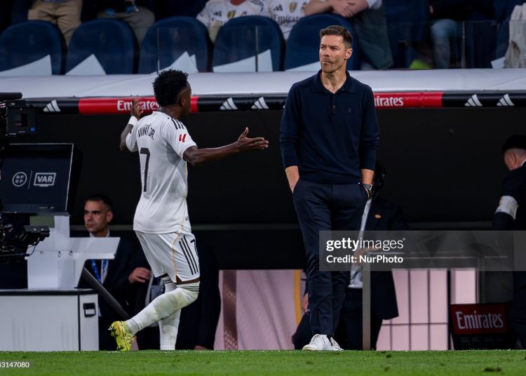 Vinicius Junior of Real Madrid protests following his replacement with Xabi Alonso, head coach of Real Madrid, during the LaLiga EA Sports football match between Real Madrid CF and FC Barcelona (Photo by Alberto Gardin/NurPhoto via Getty Images)