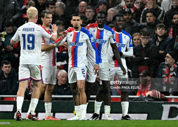 Crystal Palace's Senegalese midfielder #07 Ismaila Sarr (2R) reacts after scoring the teams second goal during the English League Cup fourth round football match between Liverpool and Crystal Palace at Anfield (Photo by PAUL ELLIS/AFP via Getty Images)