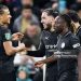 Rayan Cherki of Manchester City (2nd L) celebrates his goal with team mates Nathan Ake (L) and Jeremy Doku (R) during the Carabao Cup match between Swansea City and Manchester City (Photo by Athena Pictures/Getty Images)