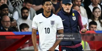 England's German head coach Thomas Tuchel (R) speaks to England's midfielder #10 Jude Bellingham as he prepares to enter the pitch (Photo by PAUL ELLIS/AFP via Getty Images)
