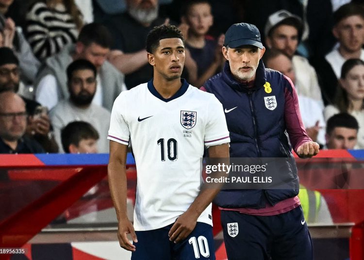 England's German head coach Thomas Tuchel (R) speaks to England's midfielder #10 Jude Bellingham as he prepares to enter the pitch (Photo by PAUL ELLIS/AFP via Getty Images)