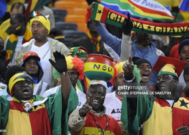 Ghanaian supporters cheer prior to their Group D first round 2010 World Cup football match on June 23, 2010 at Soccer City (Photo credit should read STEPHANE DE SAKUTIN/AFP via Getty Images)