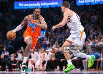 Jalen Williams #8 of the Oklahoma City Thunder brings the ball up court around Collin Gillespie #12 of the Phoenix Suns (Photo by William Purnell/Getty Images)