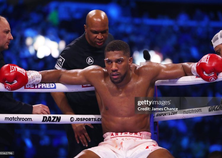 Coach Derrick James speaks to Anthony Joshua in between rounds during the Heavyweight fight between Anthony Joshua and Jermaine Franklin at The O2 Arena on April 01, 2023 (Photo by James Chance/Getty Images)