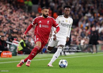 Mohamed Salah of Liverpool breaks away from Vinicius Junior of Real Madrid during the UEFA Champions League 2025/26 League Phase MD4 match between Liverpool FC and Real Madrid C.F. (Photo by Michael Regan/Getty Images)