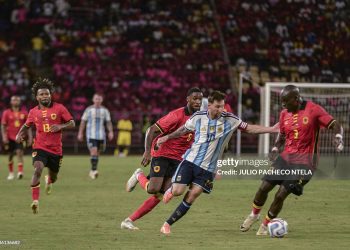 Argentina's forward #10 Lionel Messi (2nd R) vies for the ball with Angola's #3 Jonathan Buatu (R) and Angola's #6 Gaspar Kialonda (4th L) during the friendly match between Angola and Argentina in Luanda on November 14, 2025. Football icon Lionel Messi created the first goal and scored the second as world champions Argentina beat Angola 2-0 in an international friendly (Photo by JULIO PACHECO NTELA/AFP via Getty Images)