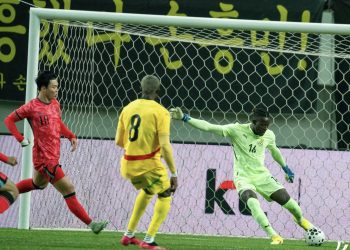 Benjamin Asare attempts to clear ball in friendly game against South Korea  Photo Courtesy: GFA