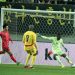 Benjamin Asare attempts to clear ball in friendly game against South Korea  Photo Courtesy: GFA