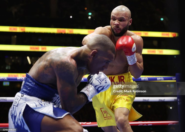 Chris Eubank Jr. (yellow shorts)  and Conor Benn (white and blue shorts) during their Middleweight Contest at Tottenham Stadium (Photo by Mark Robinson/Matchroom Boxing/Getty Images)