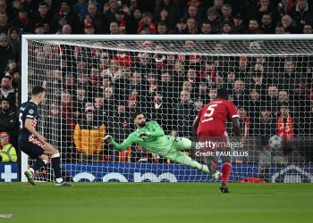 PSV Eindhoven's Croatian forward #05 Ivan Perisic (L) shoots from the penalty spot to score his team's  opening goal during the UEFA Champions League league phase football match between Liverpool and PSV Eindhoven (Photo by Paul ELLIS / AFP via Getty Images)