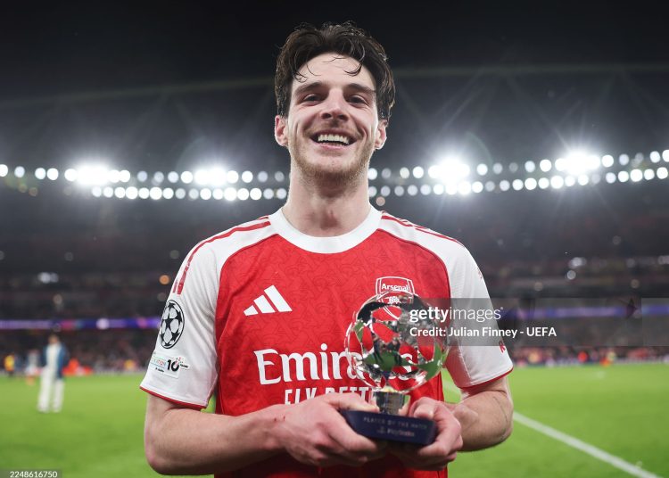 Declan Rice of Arsenal poses for a photo with the PlayStation Player Of The Match award after the UEFA Champions League 2025/26 League Phase MD5 match between Arsenal FC and FC Bayern München (Photo by Julian Finney - UEFA/UEFA via Getty Images)