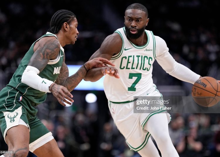 Jaylen Brown #7 of the Boston Celtics drives to the basket on Kevin Porter Jr. #7 of the Milwaukee Bucks (Photo by John Fisher/Getty Images)