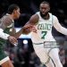 Jaylen Brown #7 of the Boston Celtics drives to the basket on Kevin Porter Jr. #7 of the Milwaukee Bucks (Photo by John Fisher/Getty Images)