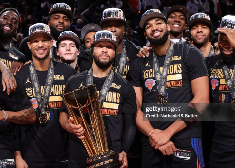 The New York Knicks pose for a photo with the 2025 Emirates NBA Cup Championship Trophy Photo Courtesy: Getty Images