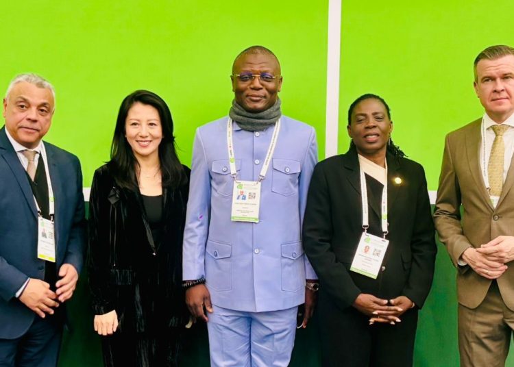 Kofi Adams with some dignitaries at the  World Anti-Doping Agency (WADA)