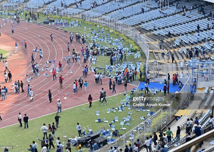 Fans throw chairs and storm on to the field at Vivekananda Yuva Bharati Krirangan (VYBK) during the Lionel Messi G.O.A.T Tour on December 13, 2025 in Kolkata, India. (Photo by Ayush Kumar/Getty Images)