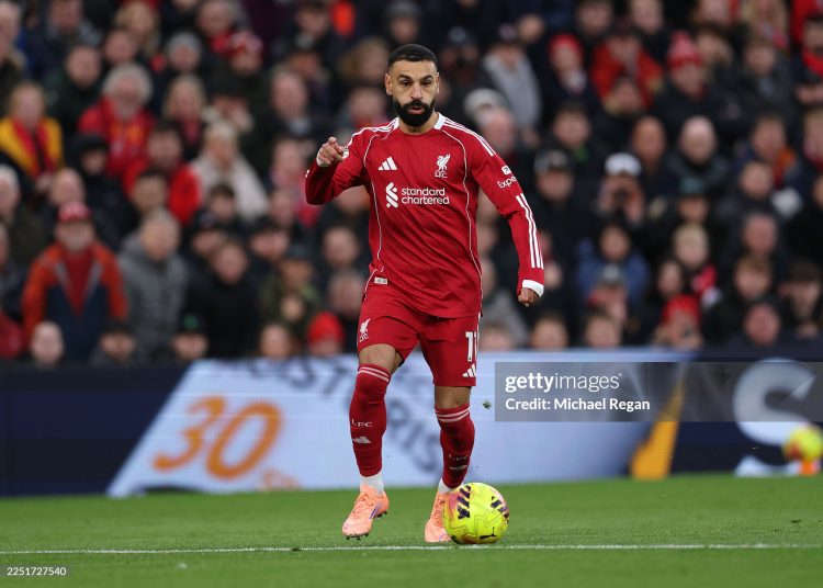 Mohamed Salah of Liverpool runs with the ball during the Premier League match between Liverpool and Brighton & Hove Albion at Anfield (Photo by Michael Regan/Getty Images)
