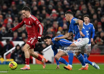 Florian Wirtz of Liverpool runs with the ball whilst under pressure from Granit Xhaka of Sunderland during the Premier League match between Liverpool and Sunderland at Anfield (Photo by Liverpool FC/Liverpool FC via Getty Images)