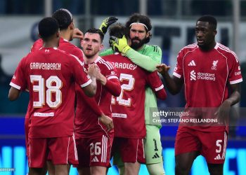 Liverpools players celebrate after winning the UEFA Champions League phase day 6 football match between Inter Milan and Liverpool (Photo by Stefano RELLANDINI / AFP via Getty Images)