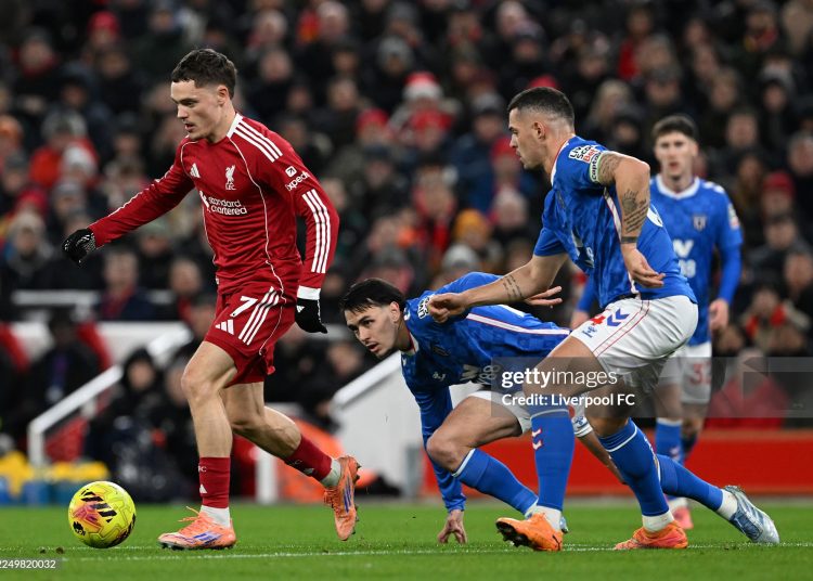 Florian Wirtz of Liverpool runs with the ball whilst under pressure from Granit Xhaka of Sunderland during the Premier League match between Liverpool and Sunderland at Anfield (Photo by Liverpool FC/Liverpool FC via Getty Images)