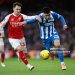 Martin Zubimendi of Arsenal and Diego Gomez of Brighton & Hove Albion battle for possession during the Premier League match between Arsenal and Brighton & Hove Albion (Photo by Shaun Botterill/Getty Images)