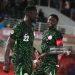 Nigerian forward Akor Jerome Adams and midfielder Wilfred Ndidi celebrate a goal during the match between Nigeria and Tanzania (Photo by Issam Zerrok / Hans Lucas / AFP via Getty Images)