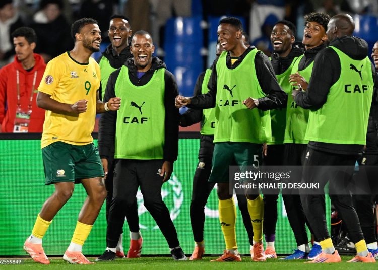 South Africa's forward #09 Lyle Foster (L) celebrates scoring his team's second goal with his teammates during the Africa Cup of Nations (CAN) Group B football match between South Africa and Angola (Photo by Khaled DESOUKI / AFP via Getty Images)