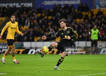 Mason Mount of Manchester United scores his team's third goal during the Premier League match between Wolverhampton Wanderers and Manchester United (Photo by Shaun Botterill/Getty Images)