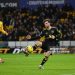 Mason Mount of Manchester United scores his team's third goal during the Premier League match between Wolverhampton Wanderers and Manchester United (Photo by Shaun Botterill/Getty Images)