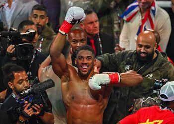 British boxer Anthony Joshua celebrates after defeating US boxer and influencer Jake Paul (off frame) in a non-title heavyweight bout at the Kaseya Center in Miami, Florida, on December 19, 2025. (Photo by Giorgio VIERA / AFP via Getty Images)