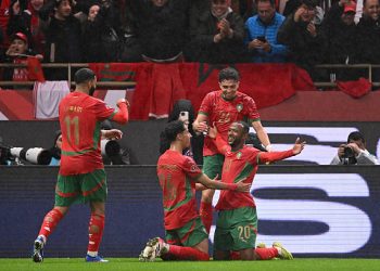 Morocco's forward #20 Ayoub El Kaabi celebrates with teammates after scoring his team's second goal SEBASTIEN BOZON / AFP via Getty Images)