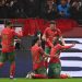 Morocco's forward #20 Ayoub El Kaabi celebrates with teammates after scoring his team's second goal SEBASTIEN BOZON / AFP via Getty Images)