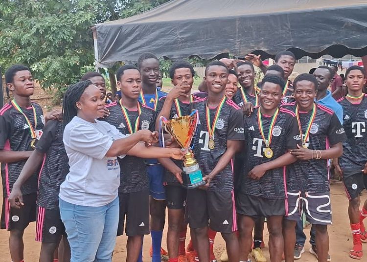 Kwamang boys; Winners of the boys division posing with the trophy
