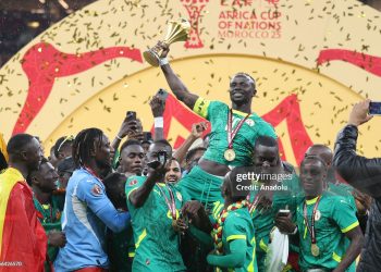 RABAT, MOROCCO - JANUARY 19: Senegalese players raise the trophy after winning the 35th Africa Cup of Nations (AFCON 2025) final match against Morocco at the Prince Moulay Abdellah Stadium in the capital Rabat, Morocco on January 19, 2026. Senegal won the 35th Africa Cup of Nations title on Sunday, defeating hosts Morocco 1-0 after extra time in a dramatic final marked by lengthy stoppage-time scenes. (Photo by Samah Zidan/Anadolu via Getty Images)