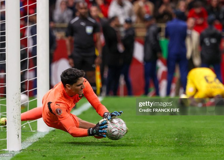 Morocco's goalkeeper #01 Yassine Bounou stops a penaly kick from Nigeria's forward #11 Samuel Chukwueze during the Africa Cup of Nations (CAN) semi-final football match between Nigeria and Morocco (Photo by FRANCK FIFE / AFP via Getty Images)